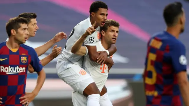 Thomas Muller (centre) celebrates scoring for Bayern Munich against Barcelona