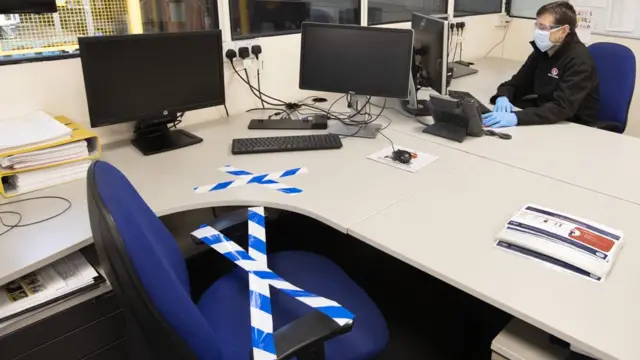 A member of staff at the Vauxhall car factory in Ellesmere Port, Wirral, working in his office during preparedness tests and redesign ahead of re-opening following the Covid-19 outbreak.