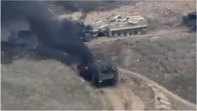 తగలబడుతున్న ఆర్మీ వాహనాలు