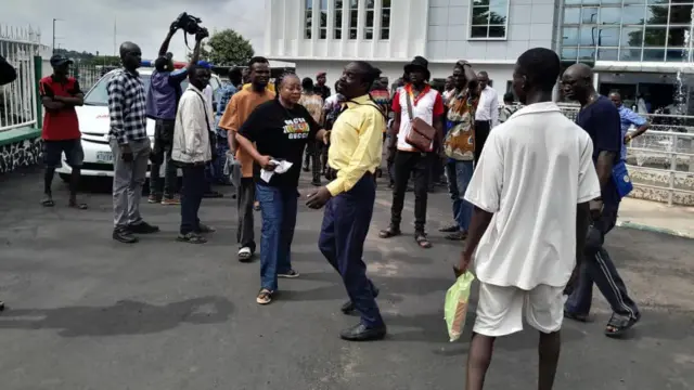 People gathered at the secretariat where the boy who was shot was taken to