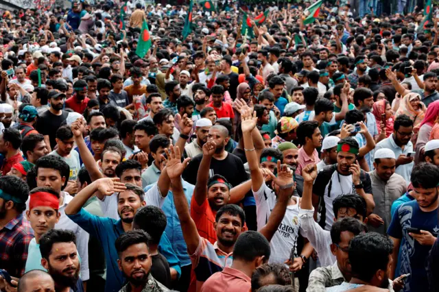 People celebrate the resignation of Prime Minister Sheikh Hasina in Dhaka, Bangladesh, August 5, 2024.