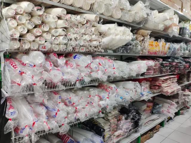 Tumpukan plastik gelas di sebuah warung di Biak, Papua.