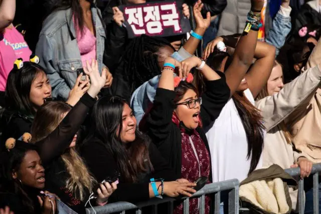 Getty Images // NEW YORK, NY - MAY 15: Fans cheer as K-Pop group BTS performs in Central Park, May 15, 2019 in New York City. Fans waited in line for days to see the group perform as part of ABC's 'Good Morning America' summer concert series. (Photo by Drew Angerer/Getty Images)