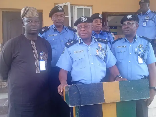 DCP Anthony Okon Placid wear blue police uniform with oda police authorizes during di media briefing for Police Headquarters, Port Harvest 
