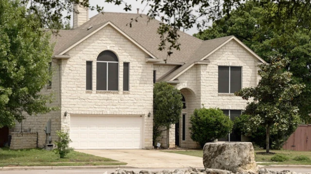 Two-story house with front lawn