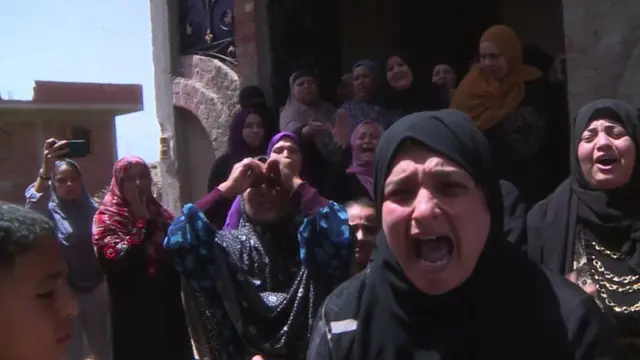 Women in an Egyptian village where many are feared drowned in the Mediterranean
