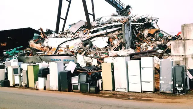 Rubbish heap of fridges, TVs and other electrical waste