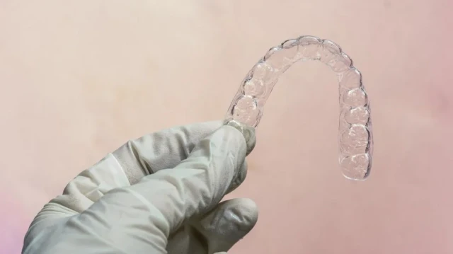 Rubber glove hand dey hold braces