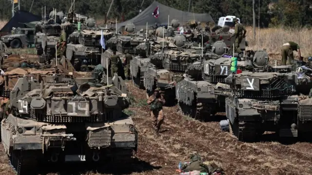 Israeli tanks assemble in the north of the country close to the border with Lebanon