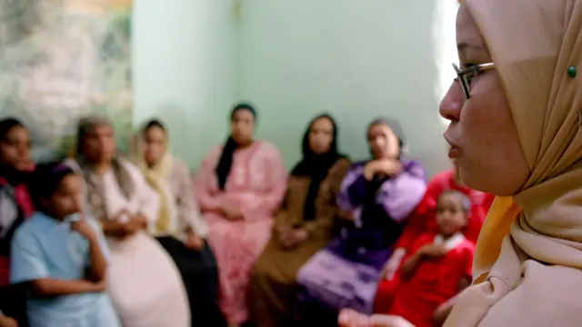 A counsellor talks to a group of women to try to convince them that they should not have FGM (Female Genital Mutilation) performed on their daughters in Minia, Egypt.