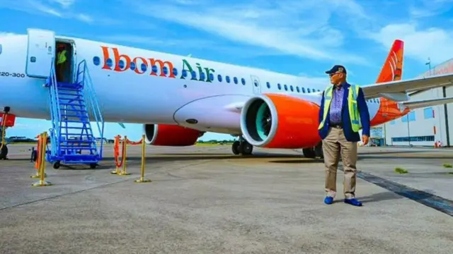 Pesin stand in front of Ibom Airline