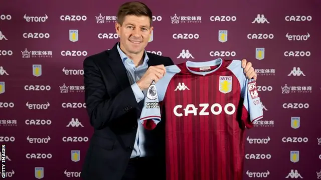 Steven Gerrard holds up an Aston Villa shirt