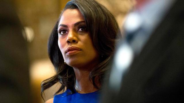 Omarosa Manigault Newman, sitting during an event