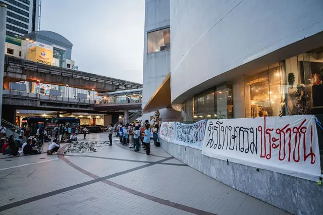 .
Protesters gather outside the Bangkok Art and Culture Centre
BANGKOK, THAILAND - 2025/07/15: Protesters gather outside the Bangkok Art and Culture Centre during the "People's Amnesty" vigil. People gathered outside Bangkok Art and Culture Centre for a candlelight vigil titled "Light Up Hope for the People's Amnesty." Organized ahead of a parliamentary debate on the 16 July 2025, the event featured personal testimonies, portraits of 50 political detainees, and a red rose display reading "Amnesty 112." Participants called for the passage of a comprehensive amnesty bill covering cases under Section 112 of the Thai Criminal Code. (Photo by Ploy Phutpheng/SOPA Images/LightRocket via Getty Images)