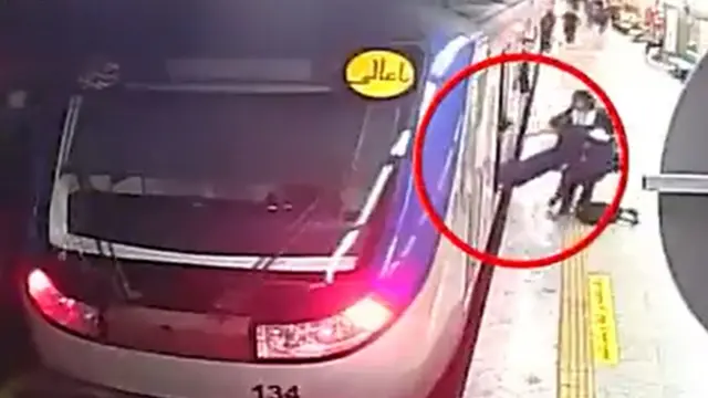 CCTV footage posted by Iran's state news agency, Irna, showing Armita Geravand being pulled unconscious from a metro train at Tehran's Shohada station on 1 October 2023