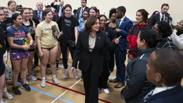 US Vice President Kamala Harris makes a surprise appearance to meet the softball team at St. Paul Central High School in Saint Paul, Minnesota on March 14, 2024. Harris was in Minnesota to promote her "Fight for Reproductive Freedoms" tour advocating for reproductive rights and abortion access. (Photo by STEPHEN MATUREN / AFP) (Photo by STEPHEN MATUREN/AFP via Getty Images)