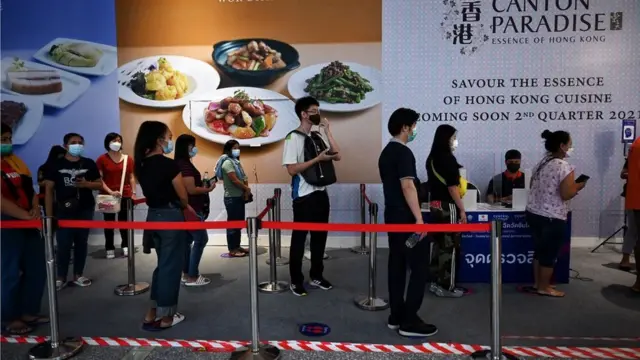 customers were waiting for an opening of shopping mall