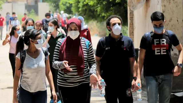 People walking with masks in Cairo during the Covid pandemic 