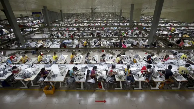 Labourers work at a garment factory in Bac Giang province, near Hanoi October 21, 2015.