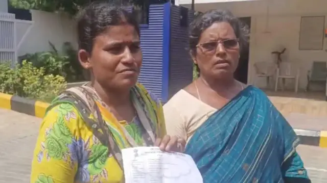 దత్తత పత్రం చూపుతున్న బాధితులు