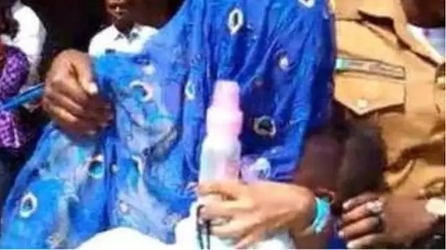 Woman wey dem cover her face