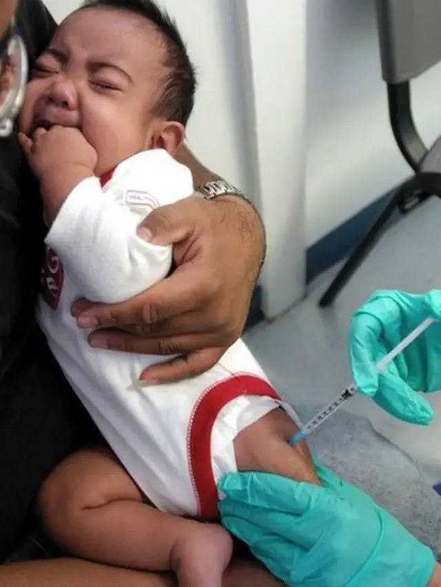 Child being given an injection