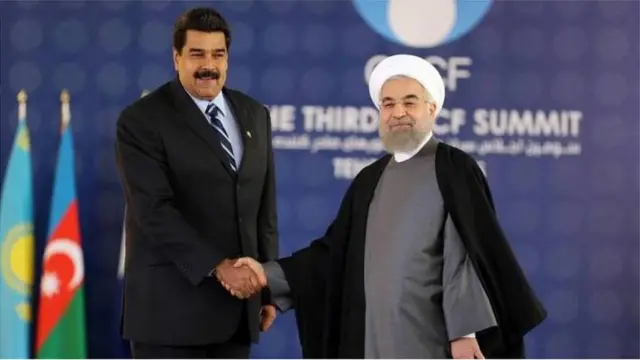 Venezuelan and Iranian leaders Nicolas Maduro and Hassan Rouhani shaking hands