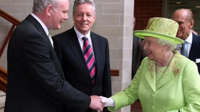 Martin McGuinness shakes hands with the Queen
