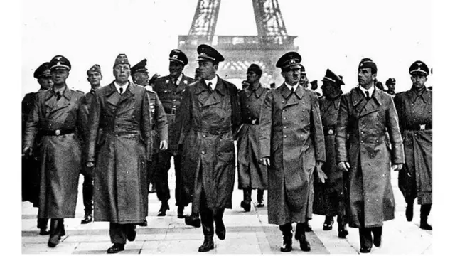 FRANCE - June 1940: World War II. Nazi leader, Adolf Hitler (1889-1945), in Paris, on the esplanade of the Chaillot palace, with the architect Albert Speer (on his left), the sculptor Arno Breker (on his right) and his staff. (Photo by Heinrich Hoffmann/Roger Viollet via Getty Images)