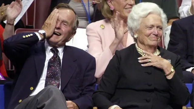 Former US President George H W Bush accompanied by former US First Lady Barbara Bush, during the evening session of the 2000 Republican National Convention in Philadelphia's First Union Center 31 July, 2000.