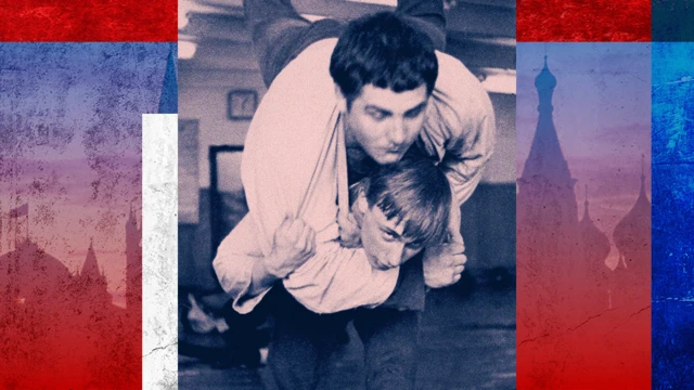 Vladimir Putin (bottom) wrestles with a classmate in St Petersburg in 1971