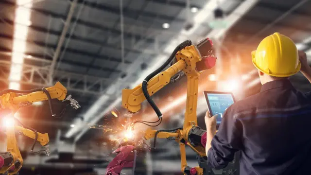 Robots construyendo un artefacto.