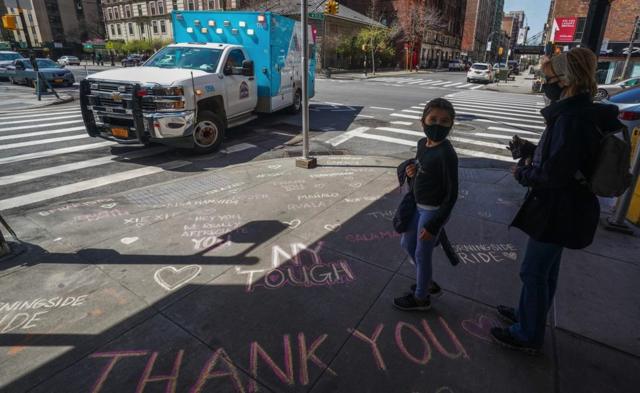 Thank you messages are written on the sidewalk outside of Mt. Sinai West Medical Center