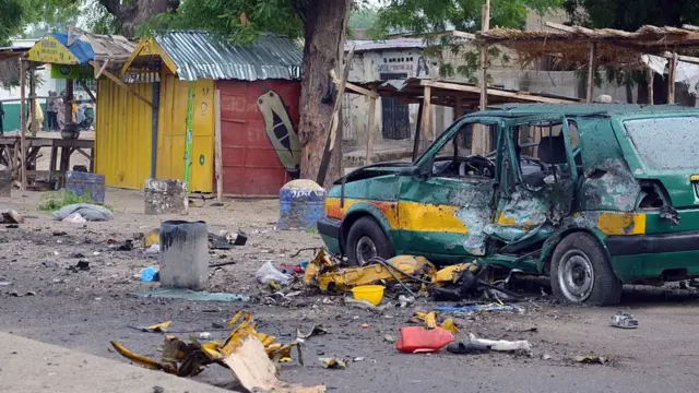 This picture shows a general view of the scene of an Improvised Explosive Device (IED) blast at Gomboru market in Maiduguri, Borno State in northeastern Nigeria on July 31, 2015 detonated by a female suicide bomber who arrived on a taxi tricycle killings at least eight people and several other.