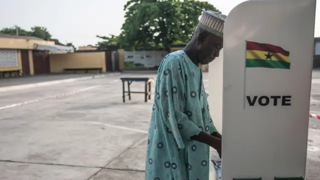 a voter in the booth