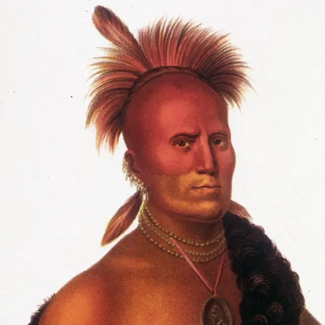Aynı yıl Washington DC'de Başkan James Monroe'yu ziyaret eden Kızılderili heyetinin bir üyesi olan Pawnee kabilesinin bir şefinin 1822 çizimi. Önü ve başının üst kısmı tıraşlı ve arkaya uzun saçları var.. Saçtan bir tüy çıkıntı yapar. Kulak memesinde kolyeler ve mücevherlerle çıplak göğüslü. Yüzü ve başı kırmızıdır.