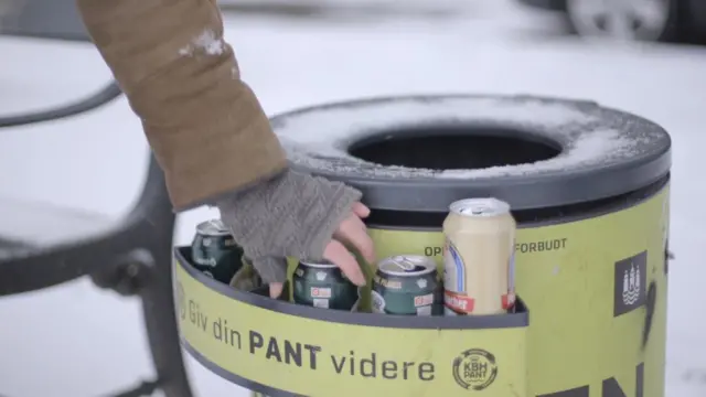 Bin shelf with person picking out can