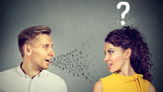 Concept image: a man is talking to a woman (there are letters coming out from his mouth) but she doesn't understand him (she's got a question mark over her head)