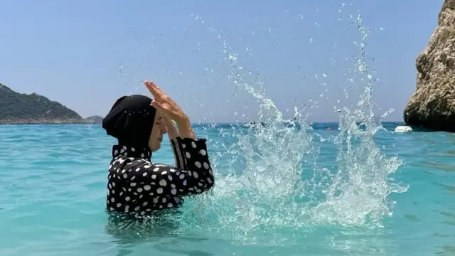 Hacer Sucuoglu Adiguzel taking a dip in sea