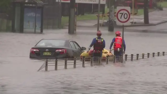 Emergency services checking car stranded