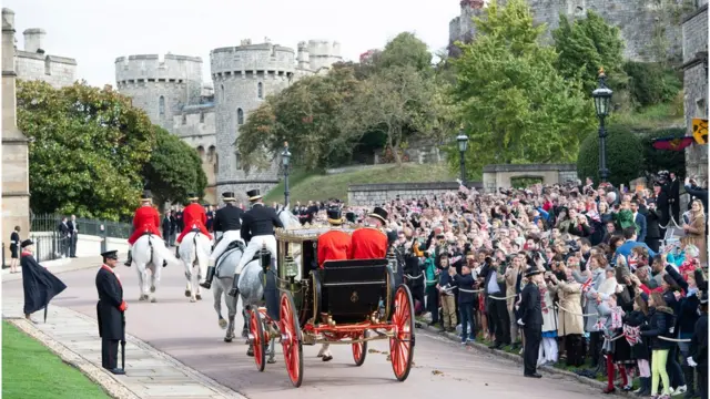 Britain"s Princess Eugenie and her husband Jack Brooksbank (unseen)