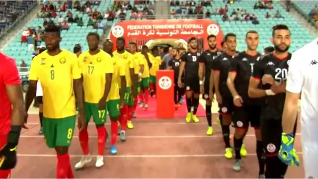 Cameroon and Tunisian players dey file out for di game