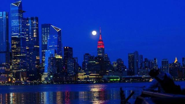 The Supermoon rises behind the Empire State Building - 7 April 2020