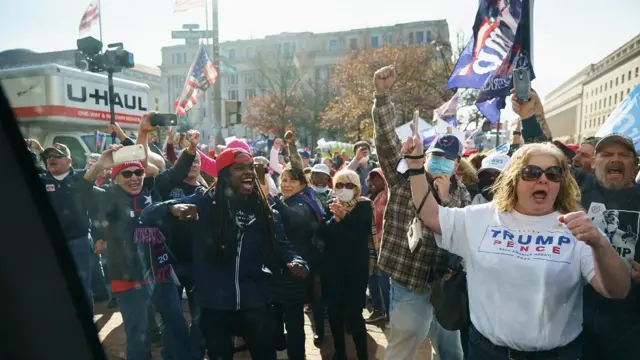 Gathering demonstrators cheered as a motorcade carrying President Trump passed as it left the White House on Saturday