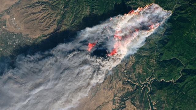 This NASA Earth Observatory handout image taken on November 8, 2018 and released on November 10, 2018 shows the Camp Fire burning in Paradise, California