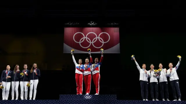 Gold medalists Team ROC pose on the podium during the medal ceremony for the during the Women's Sabre Team Fencing