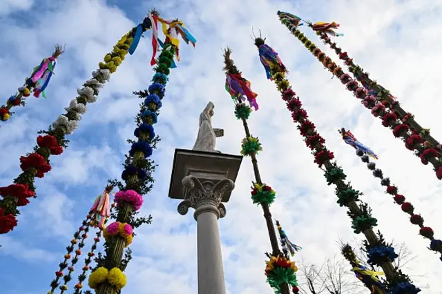 LIPNICA MUROWANA, POLAND - APRIL 10: Handmade palms surround the St. Szymon's monument during the 63rd edition of Lipnica Palms and Artistic Handicraft Competition during the Palm Sunday on April 10, 2022 in Lipnica Murowana, Poland. Palm Sunday is a Christian moveable feast that falls on the Sunday before Easter, and marks the start of Holy Week. (Photo by Omar Marques/Getty Images)