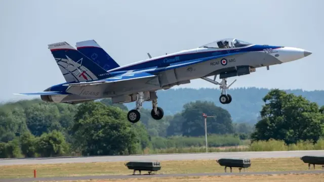 A Canadian Air Force twin tailed fighter jet, CF-18 Hornet landing at an air show