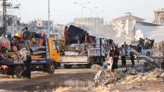 Displaced Palestinians who fled Rafah, ahead of a threatened Israeli assault, travel in Khan Younis