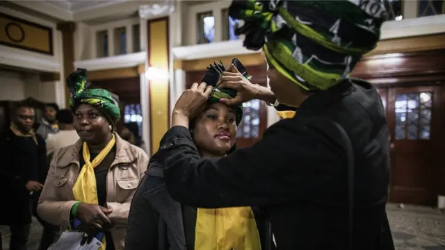 South African governing party African National Congress Women League members adjust their party attires during a election campaign event at the Johannesburg Town Hall in Johannesburg, South Africa - Wednesday 27 July 2016
